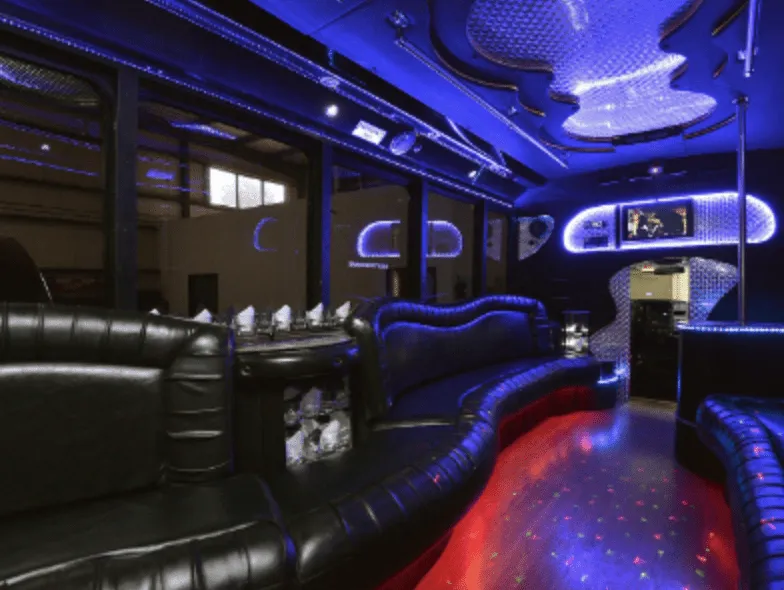 Black GMC Party Bus Black GMC Party Bus: seating area, with perimeter lounge seating, sofa-style seating and LED accent lighting