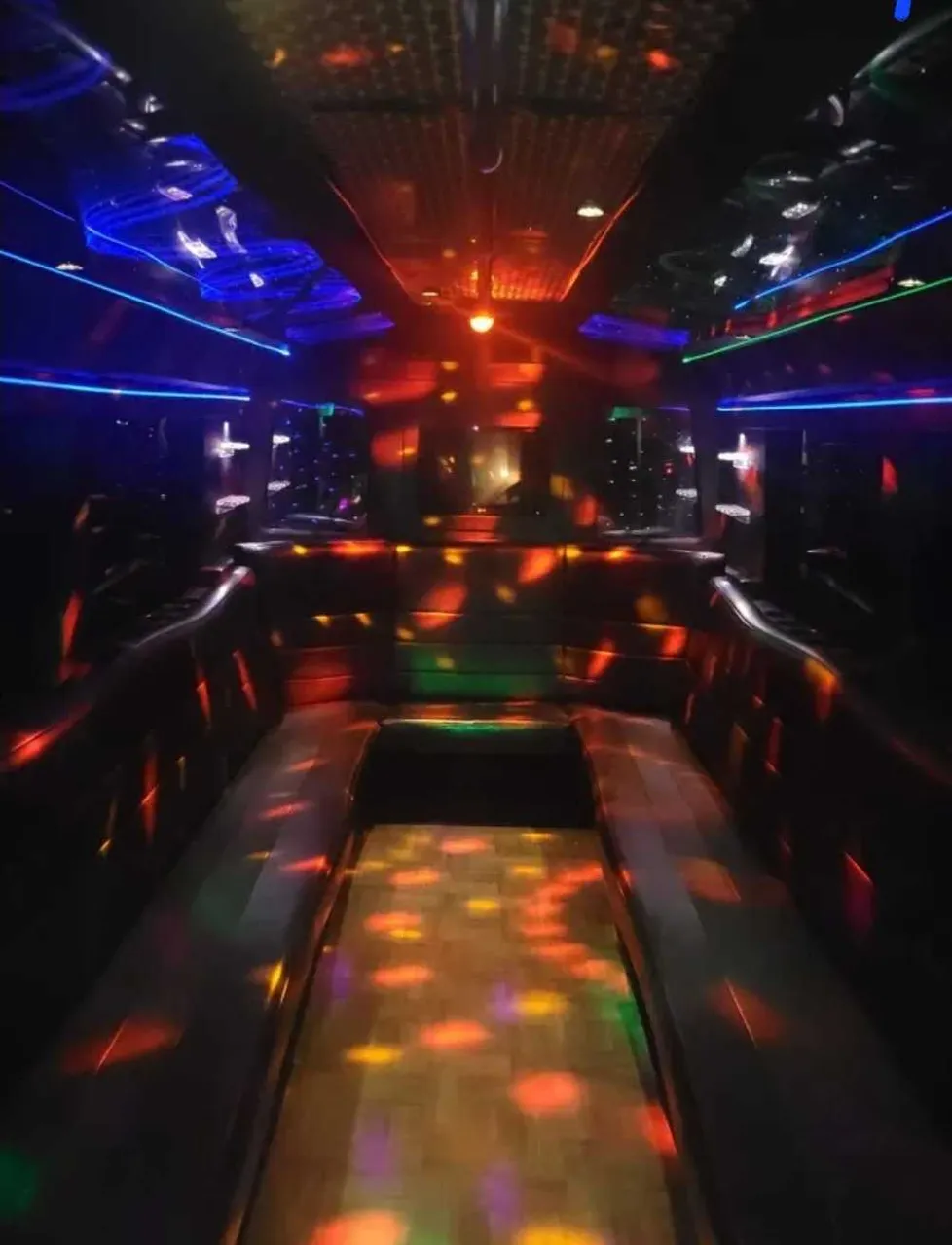 Black Party Bus: seating area, with perimeter lounge seating and LED accent lighting, pic 2