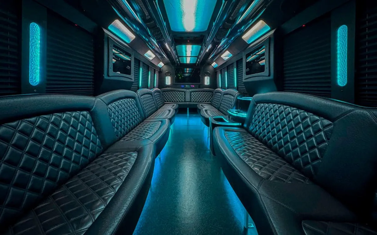 Ford F-550 Party Bus: seating area, with perimeter lounge seating, window shades and LED accent lighting