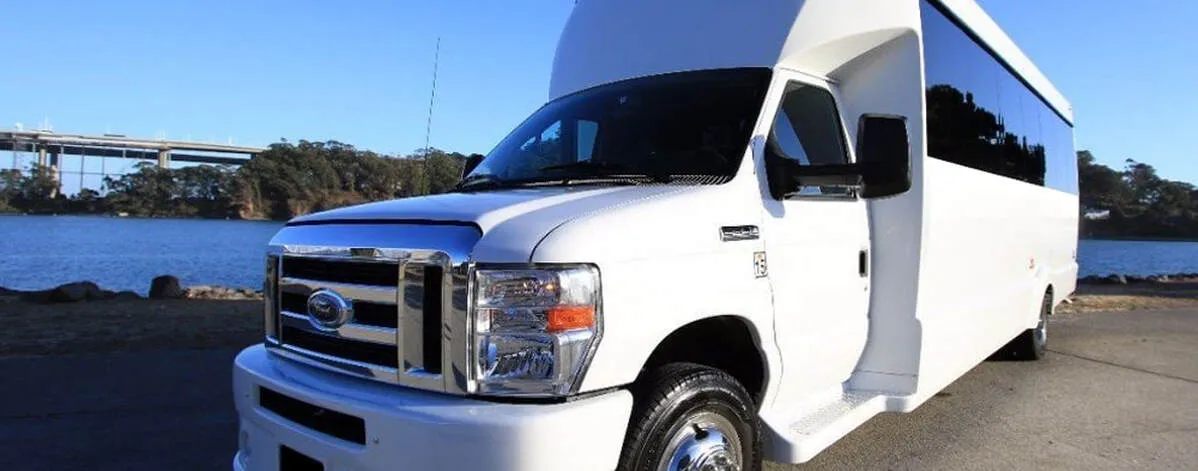 Ford F-550 Party Bus (white): full view, with tinted windows