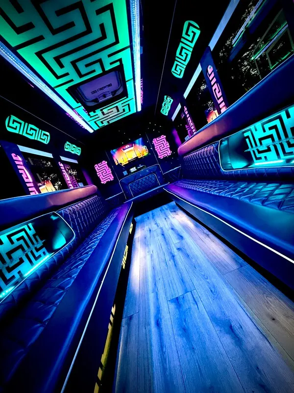 Ford E-450 Series Party Bus: seating area, with perimeter lounge seating, LED accent lighting and LED ceiling lighting