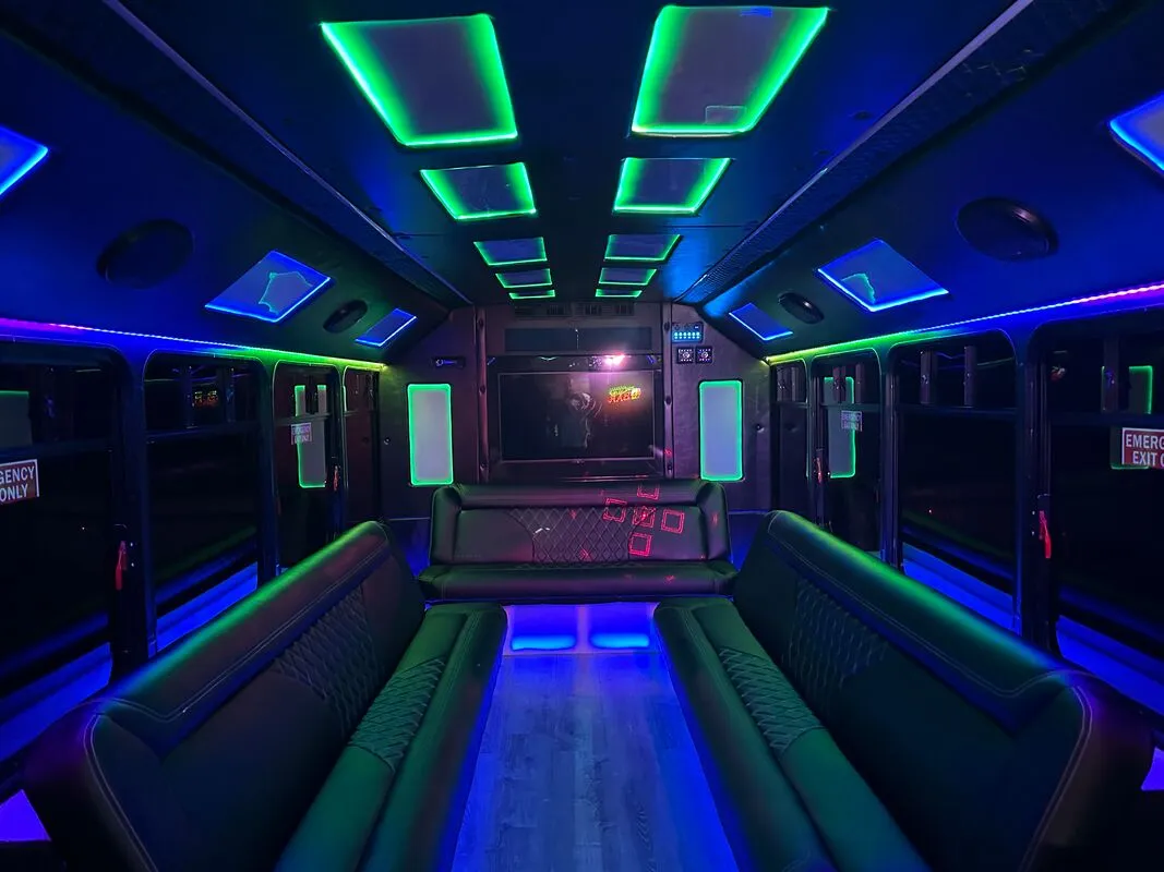 Ford E-450 Series Party Bus: seating area, with perimeter lounge seating, LED accent lighting and LED ceiling lighting, pic 7