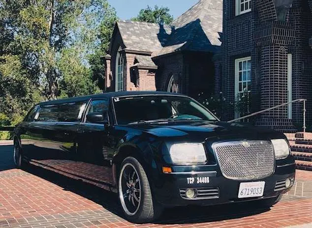 Chrysler 300 Stretch Limousine (black) for party bus rental for booking