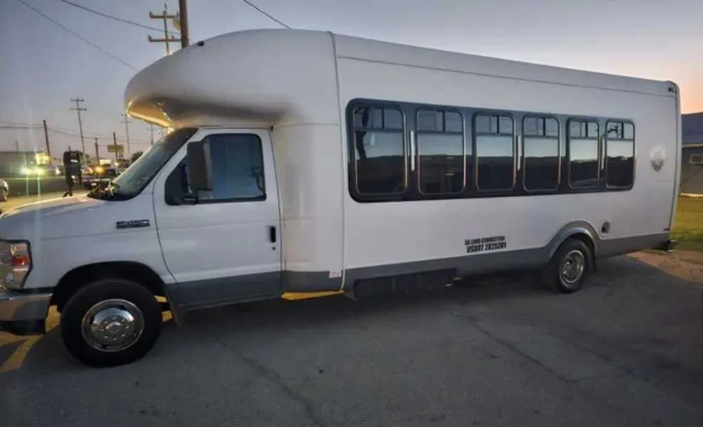 D-Town Bus (white) for party bus rental: full view