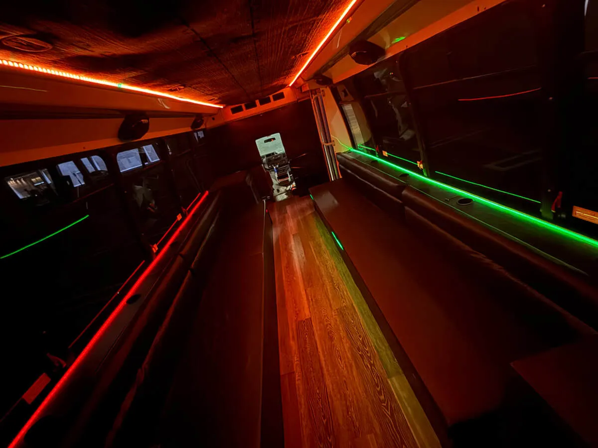 Ford E-450 Series Party Bus: seating area, with perimeter lounge seating, LED accent lighting and LED ceiling lighting, pic 10