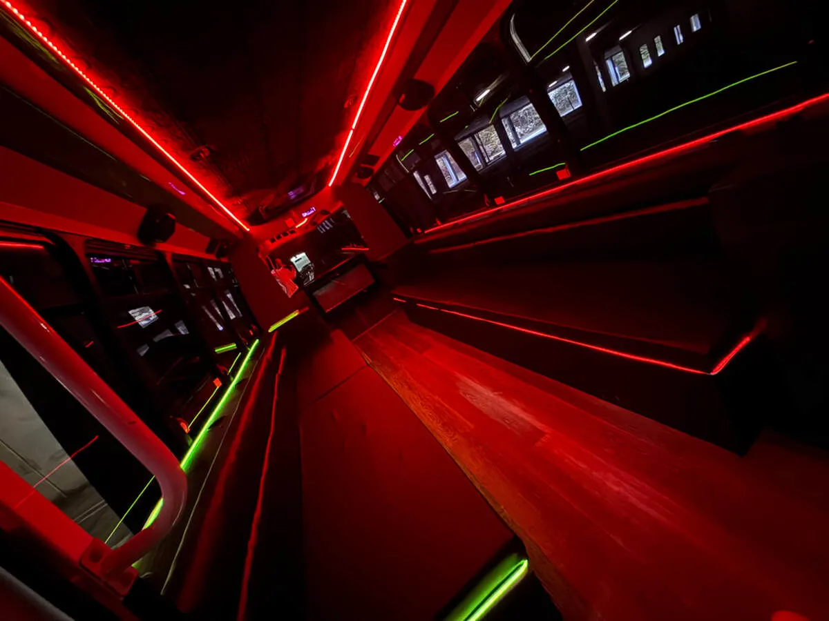 Ford E-450 Series Party Bus: seating area, with perimeter lounge seating, LED accent lighting and LED ceiling lighting, pic 8