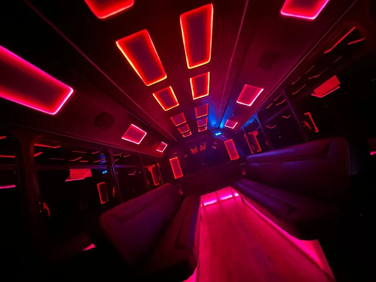 Ford E-450 Series Party Bus: seating area, with LED accent lighting and LED ceiling lighting
