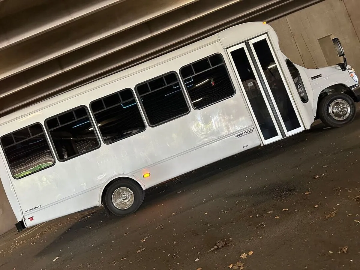 Ford E-450 Series Party Bus (white), with tinted windows