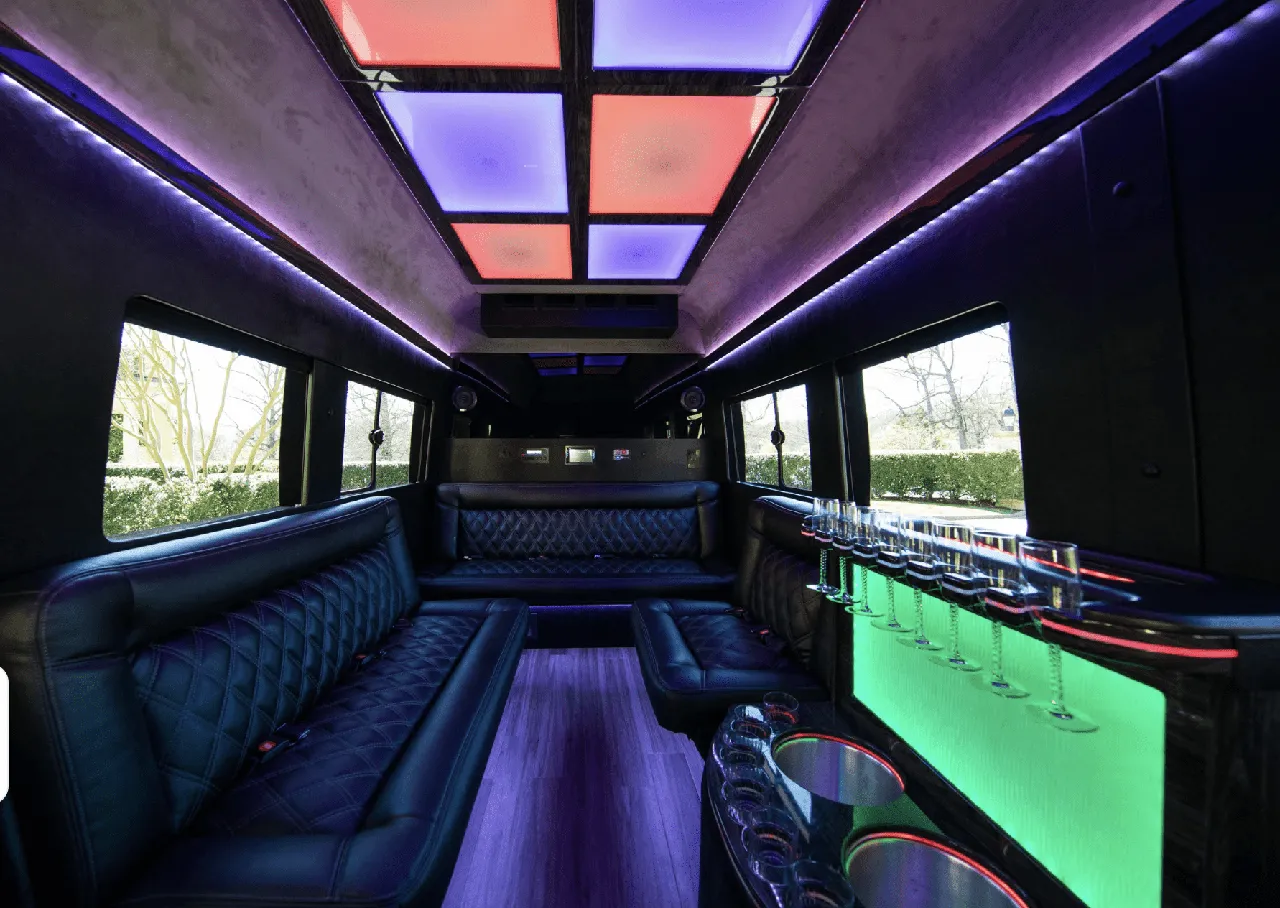 Ford Limousine Van for party bus rental: seating area, with sofa-style seating, LED accent lighting and LED ceiling lighting