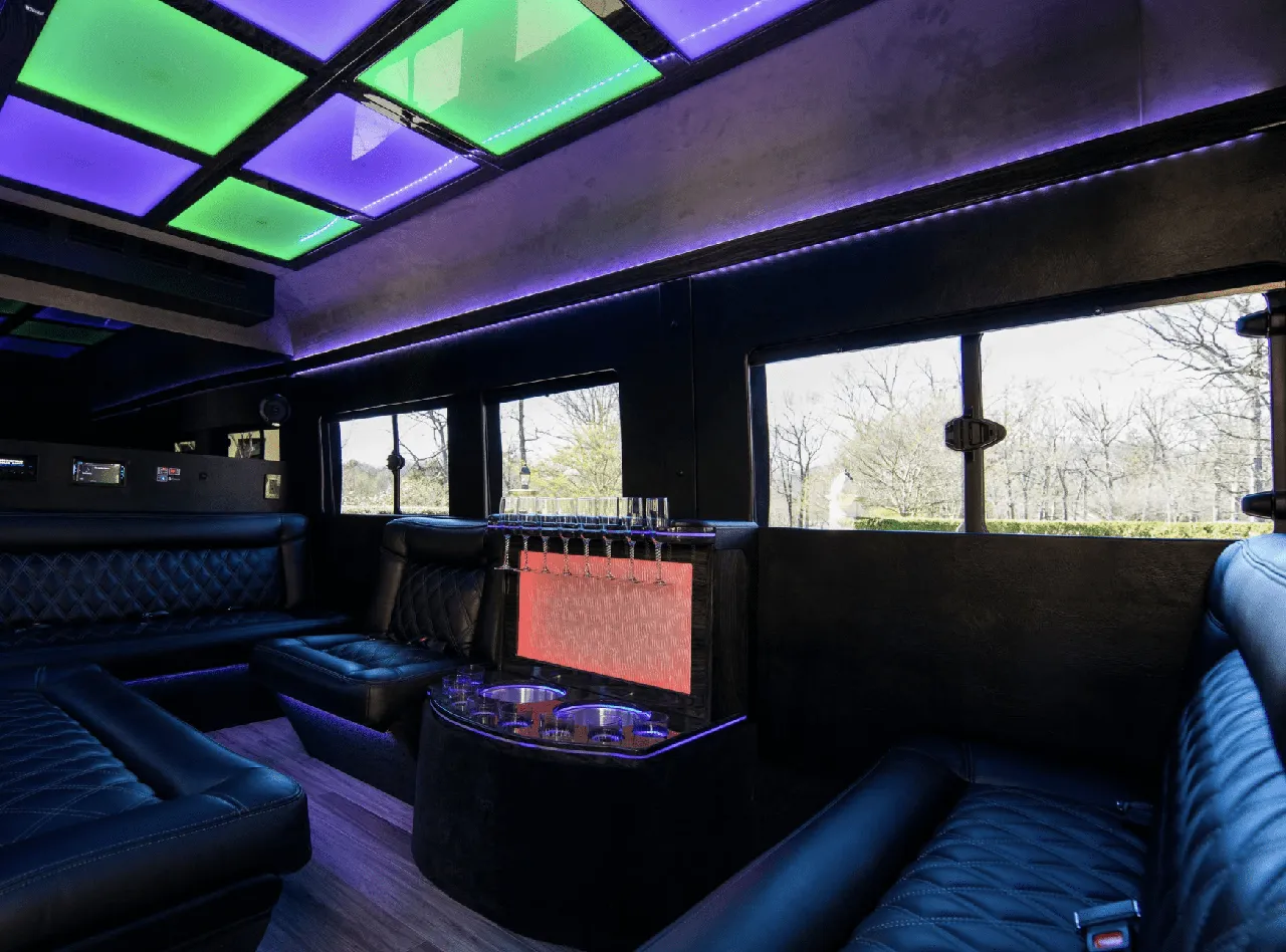 Ford Limousine Van for party bus rental: seating area, with sofa-style seating, LED accent lighting and LED ceiling lighting, pic 2