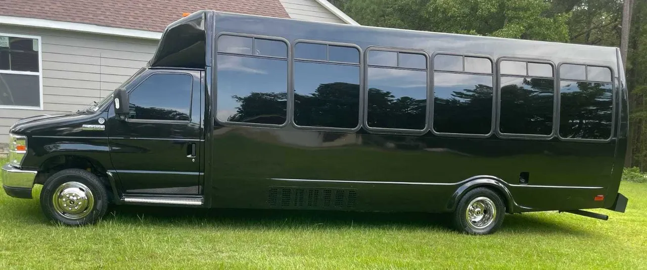 Ford Party Bus (black): full view, with tinted windows