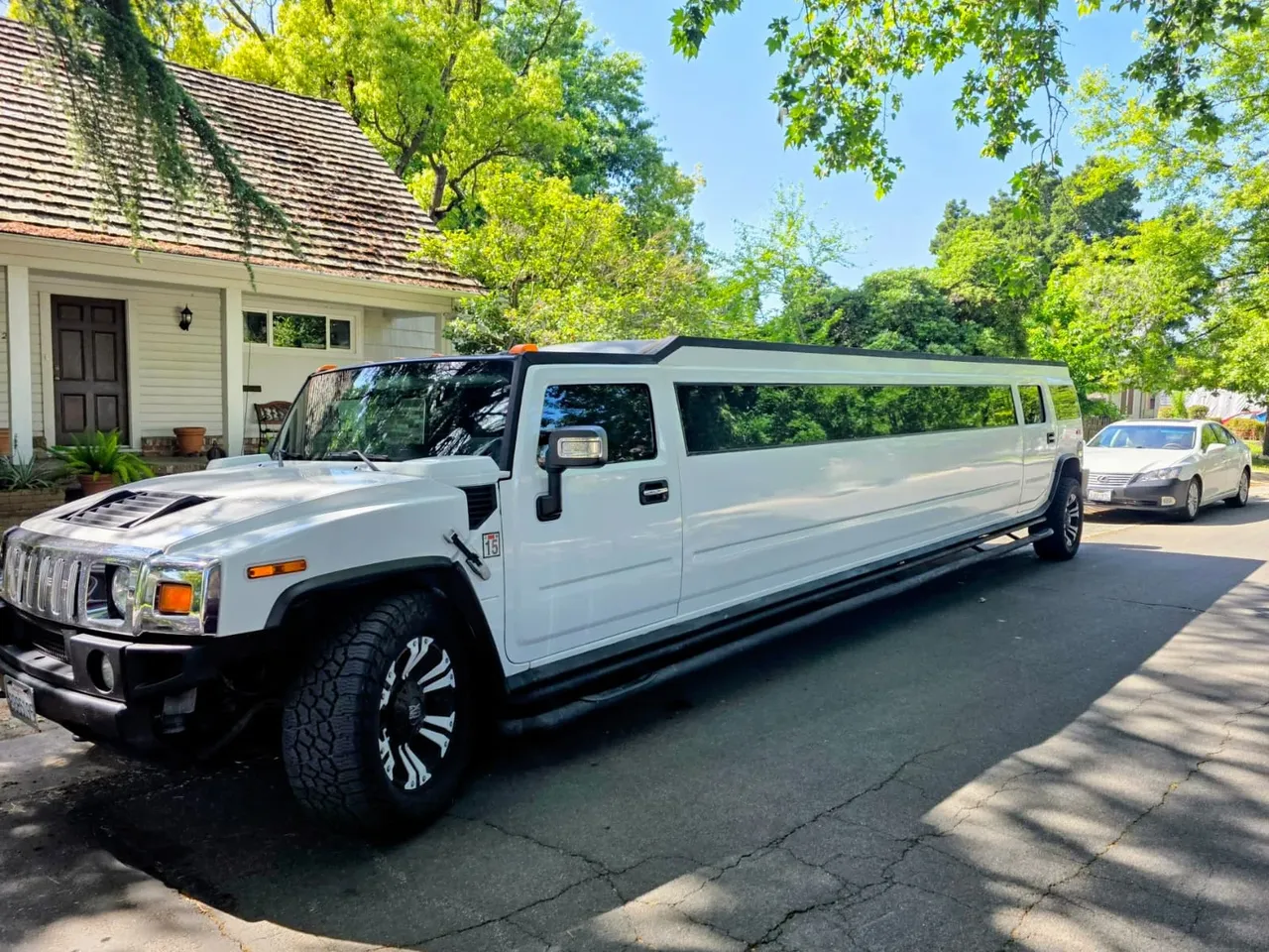 Hummer H2 White Limousine for party bus rental for booking