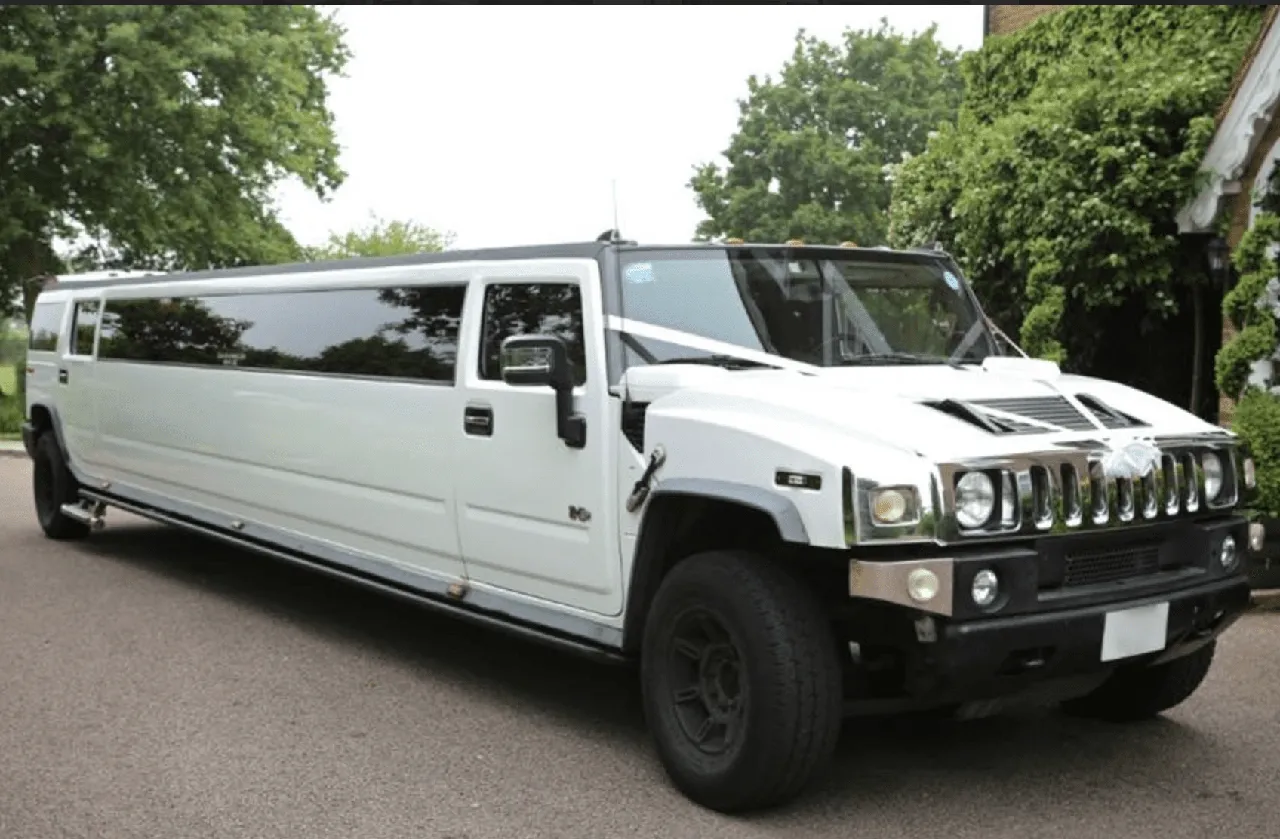 Hummer Limousine (white) for party bus rental, with tinted windows Hummer Limousine (white) for party bus rental, with tinted windows