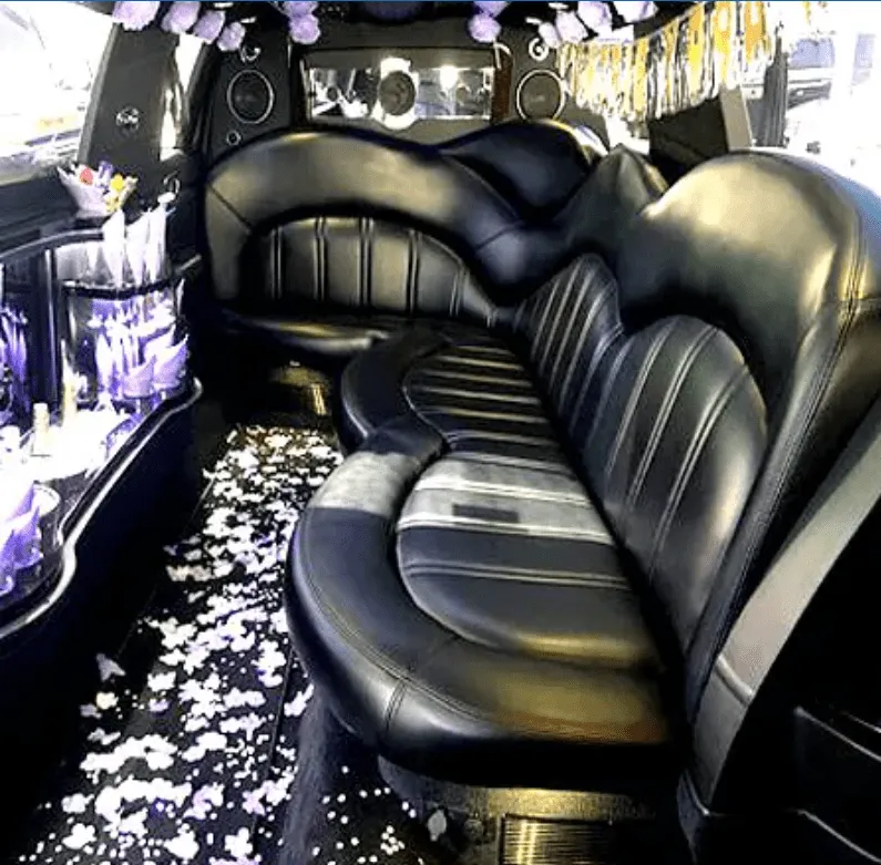 Lincoln MKT Limousine for party bus rental: seating area, with sofa-style seating