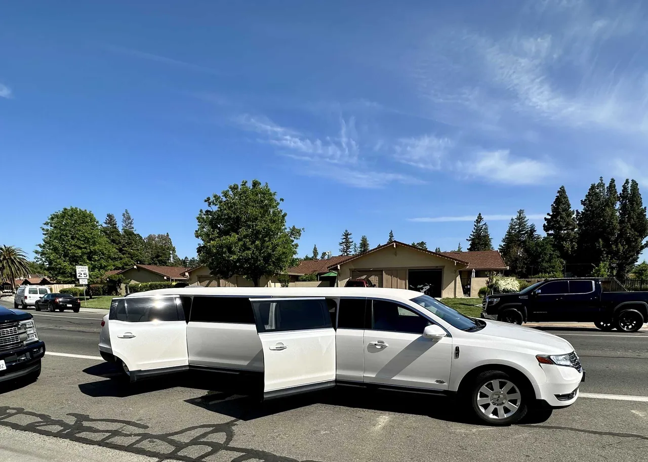 Lincoln MKT Limousine (white) for party bus rental: full view, pic 3