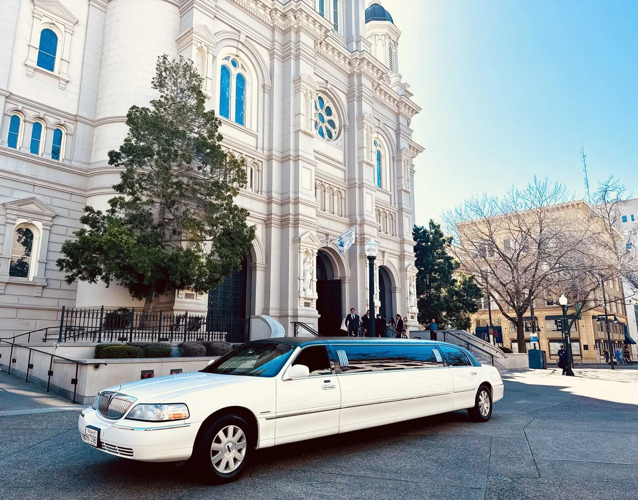 Lincoln Town Car Limousine (white) for party bus rental, with tinted windows Lincoln Town Car Limousine (white) for party bus rental, with tinted windows