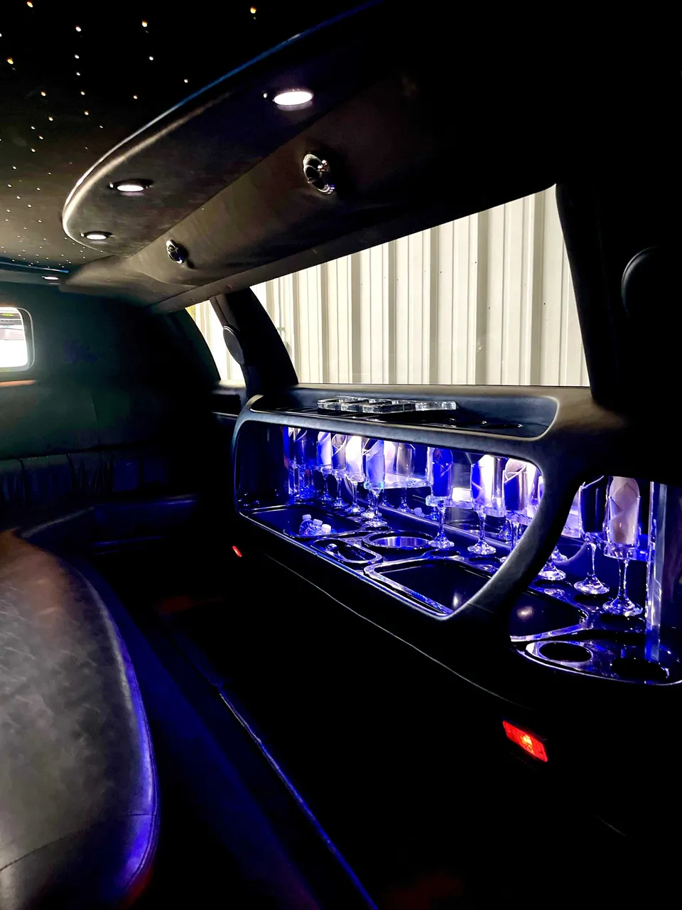 Lincoln Town Car Limousine for party bus rental: seating area, with LED accent lighting, starlight or fiber-optic ceiling and glassware holders Lincoln Town Car Limousine for party bus rental: seating area, with LED accent lighting, starlight or fiber-optic ceiling and glassware holders