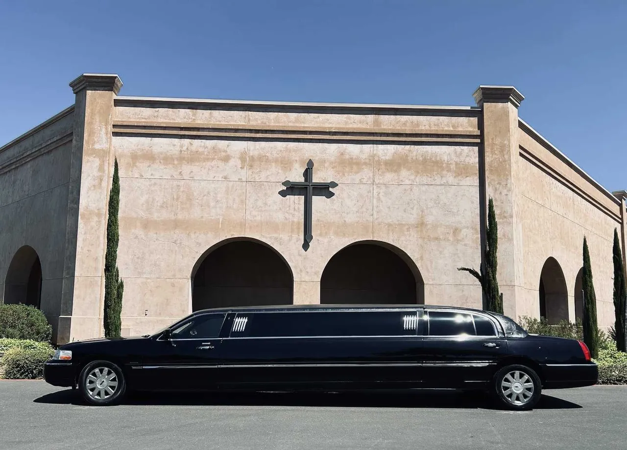 Lincoln Town Car Limousine (black) for party bus rental, with tinted windows Lincoln Town Car Limousine (black) for party bus rental, with tinted windows