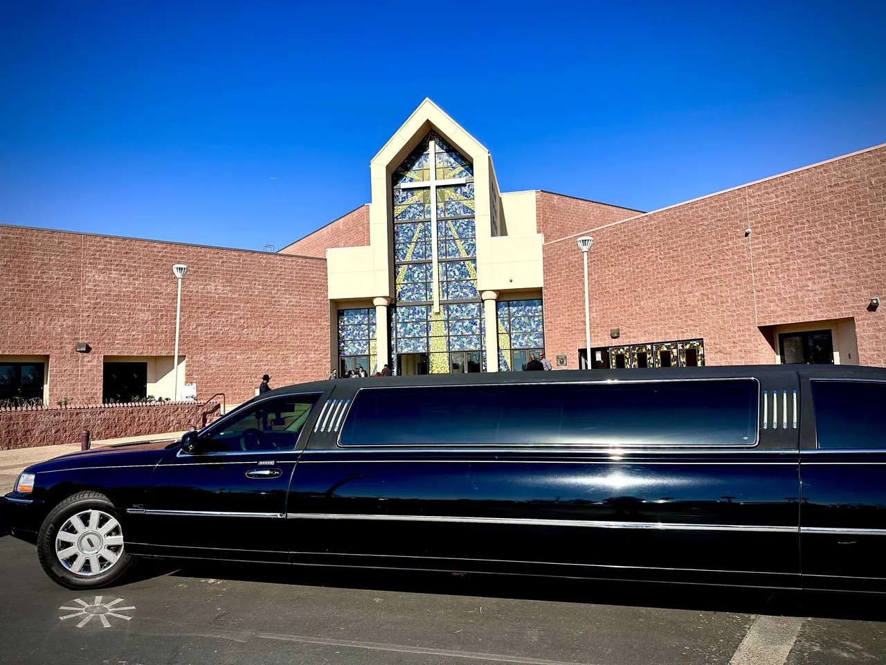 Lincoln Town Car Limousine (black) for party bus rental: full view, with tinted windows Lincoln Town Car Limousine (black) for party bus rental: full view, with tinted windows