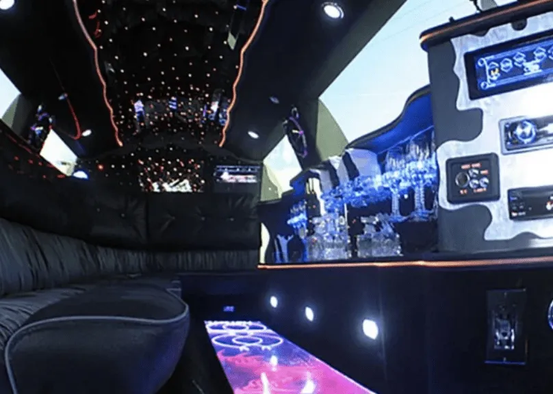 Lincoln Town Car Limousine Tuxedo for party bus rental: seating area, with LED accent lighting, starlight or fiber-optic ceiling and lit dance floor Lincoln Town Car Limousine Tuxedo for party bus rental: seating area, with LED accent lighting, starlight or fiber-optic ceiling and lit dance floor