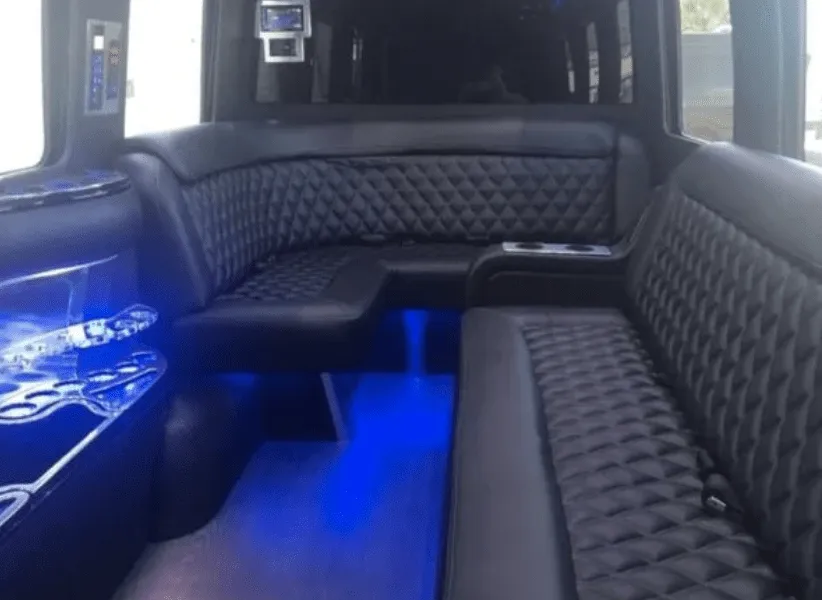 Mercedes-Benz Limousine Sprinter Mercedes-Benz Limousine Sprinter for party bus rental: seating area, with sofa-style seating, cup holders and LED accent lighting