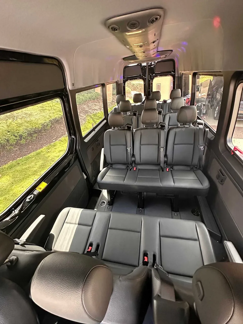 Mercedes-Benz Limousine Sprinter for party bus rental: seating area, with passenger seat belts