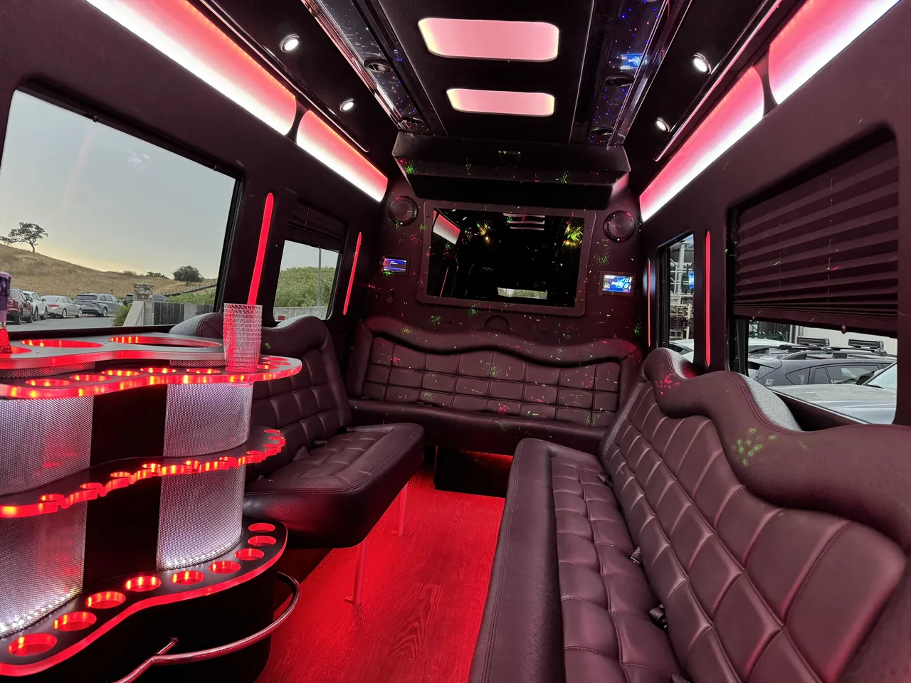 Mercedes-Benz Party Bus: seating area, with perimeter lounge seating, window shades and LED accent lighting, pic 3
