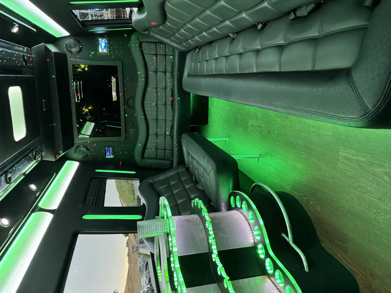 Mercedes-Benz Party Bus: seating area, with perimeter lounge seating, LED accent lighting and wood-look flooring
