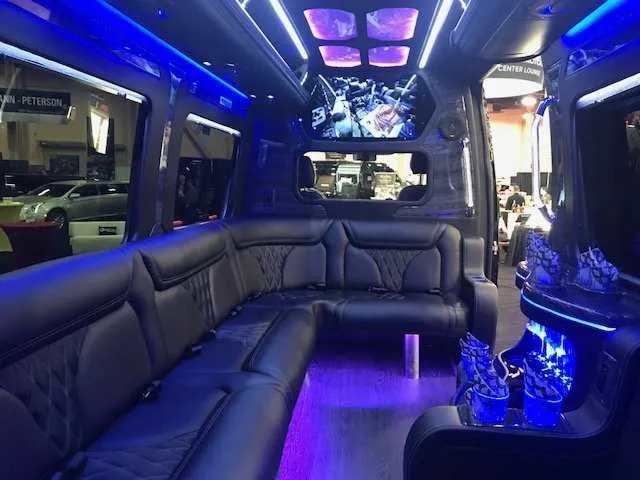 Mercedes-Benz Party Bus: seating area, with sofa-style seating, LED accent lighting and LED ceiling lighting