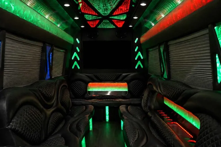 Mercedes-Benz Sprinter Limousine for party bus rental: seating area, with perimeter lounge seating, window shades and LED accent lighting, pic 5