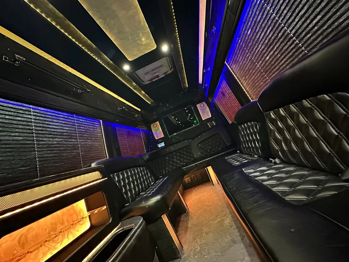 Mercedes-Benz Sprinter XL for party bus rental: seating area, with perimeter lounge seating, window shades and LED accent lighting, pic 3