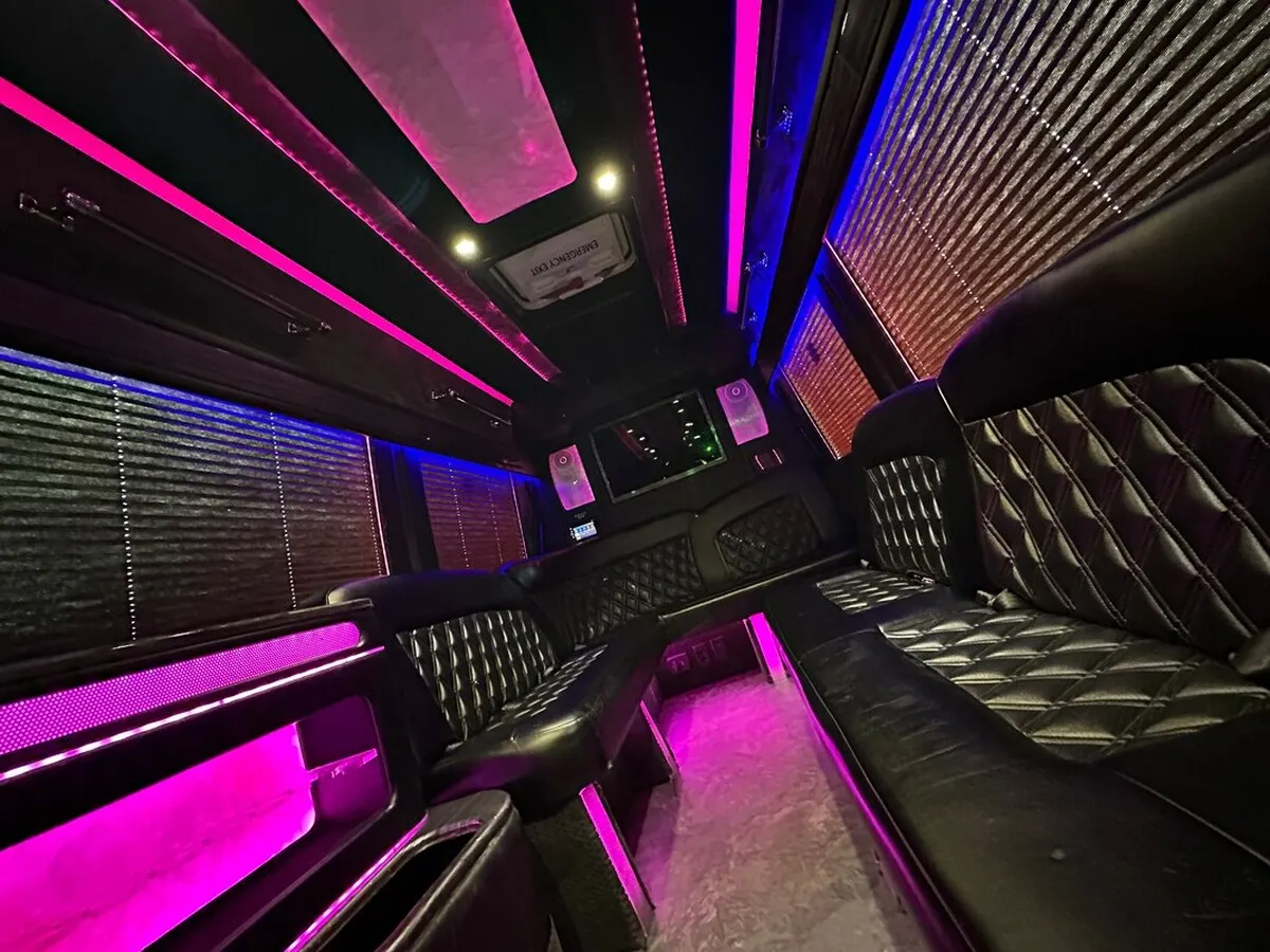 Mercedes-Benz Sprinter XL for party bus rental: seating area, with perimeter lounge seating, window shades and LED accent lighting, pic 4