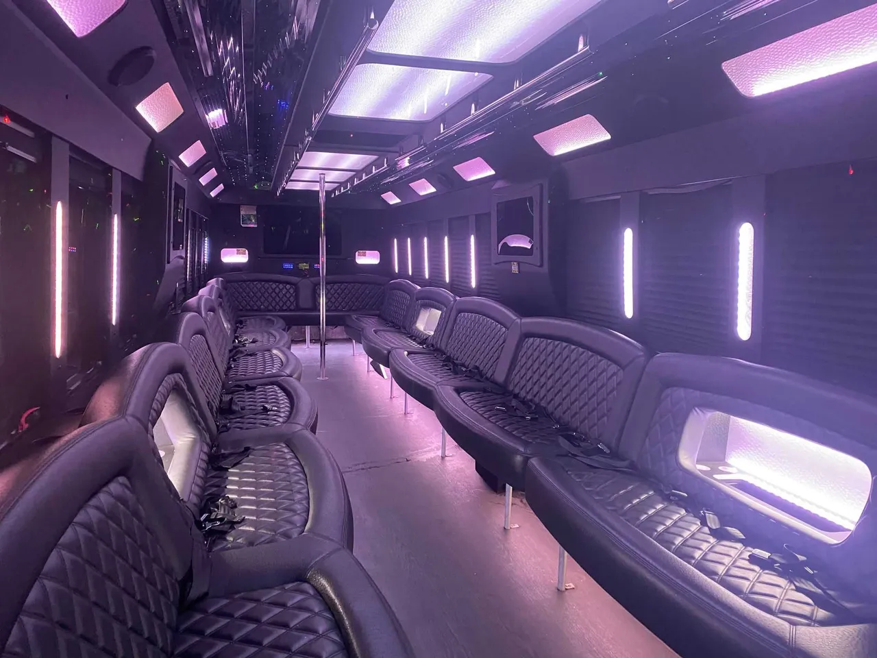 25 Passenger Party Bus: seating area, with perimeter lounge seating, LED accent lighting and LED ceiling lighting, pic 3