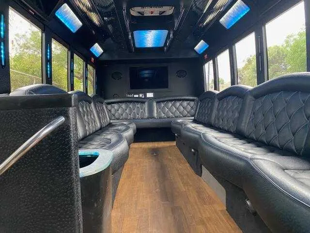 24 Passenger Party Bus 24 Passenger Party Bus: seating area, with perimeter lounge seating, LED accent lighting and LED ceiling lighting