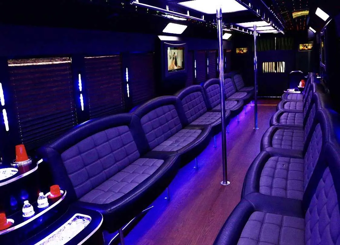 Tiffany Party Bus: seating area, with perimeter lounge seating, window shades and LED accent lighting